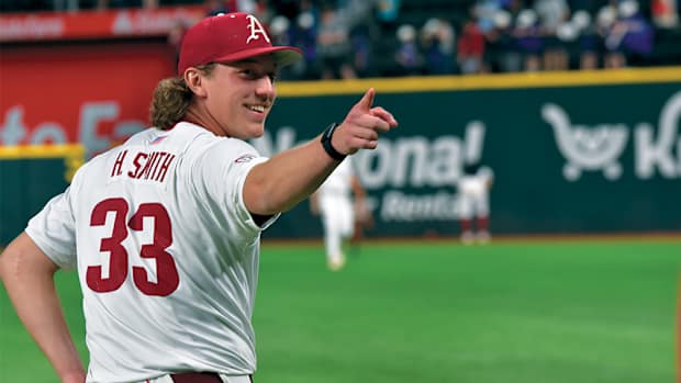Arkansas pitcher Hagan Smith enjoys his record-setting performance against Oregon State at Globe Life Field.